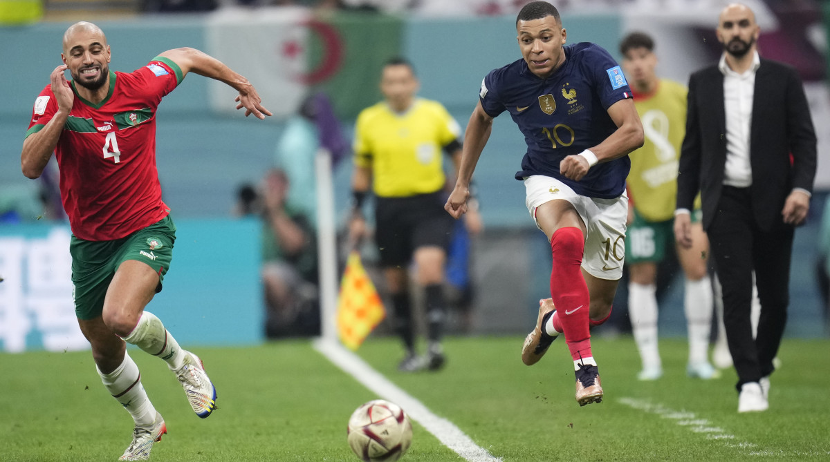 France’s Kylian Mbappé tries to get away from Morocco’s Sofyan Amrabat in the World Cup semifinals.